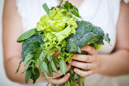 Bunch of green in female hands