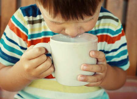 Boy drinking milkの写真素材