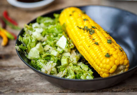 Baked corn with salad