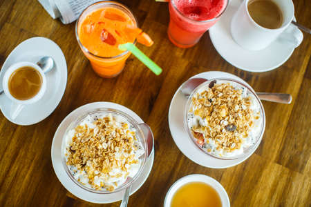 Fruits with muesli, fresh juice and espresso