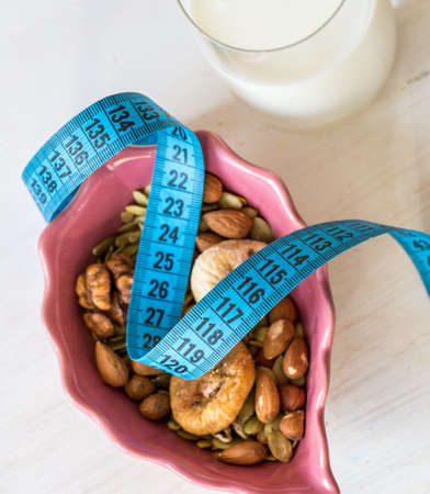 Dried Fruits, yogurt and centimeter for dietingの写真素材