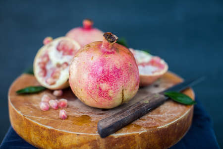 Fresh ripe garnet on wooden table close upの写真素材
