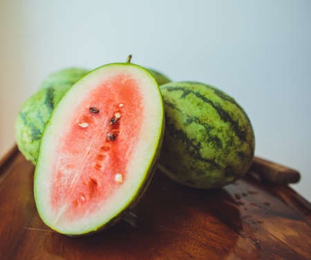 Small watermelon on  wooden board