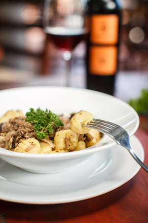 Traditional Italian dishes - gnocchi with duckの写真素材