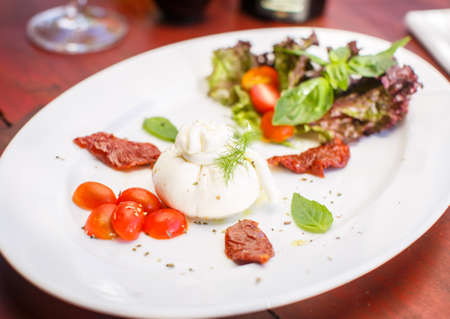 Traditional Italian dish of burrata mozzarellaの写真素材