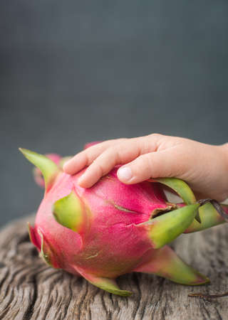 Dragon fruit on a wooden boardの写真素材