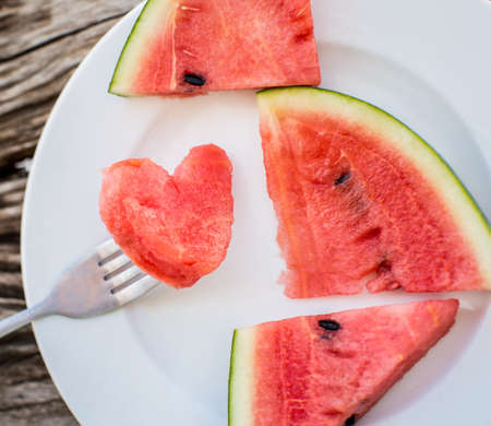 decorated watermelon slices with heart shapeの写真素材