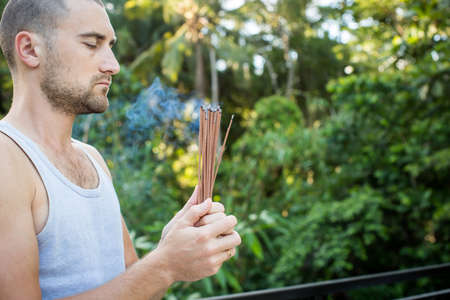 European Man Holding Incenseの写真素材