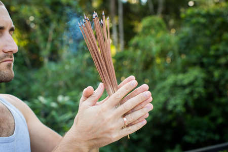 European Man Holding Incenseの写真素材