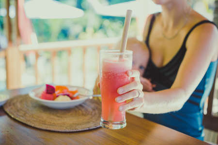 Pretty Yoga Woman Eat Tropic Breakfastの写真素材