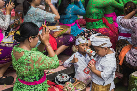 UBUD, BALI - MARCH 8: Unidentified people during performed Melasti Ritual before Balinese Day of Silence on March 8, 2016 in Ubud, Bali, Indonesia. It is a day of silence, fasting, and meditation.のeditorial素材