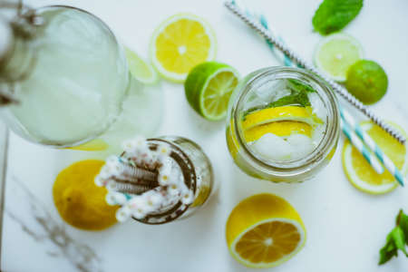 Home Kombucha with lime and lemon in the bottleの写真素材