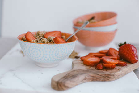 Fresh strawberries , yogurt and homemade granola for healthy breakfast