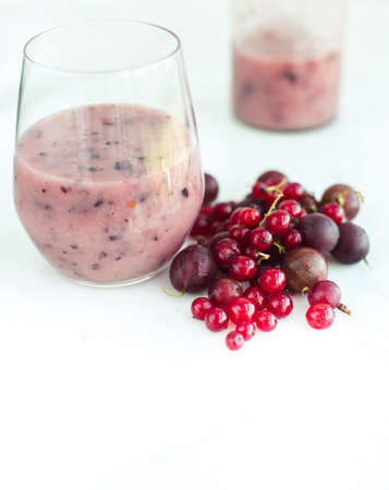 Red smoothie with frozen berries,currants and gooseberries, selective focusの写真素材