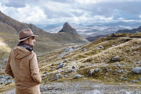 Young man in Hat starting an adventure in the mountain in Montenegroの写真素材