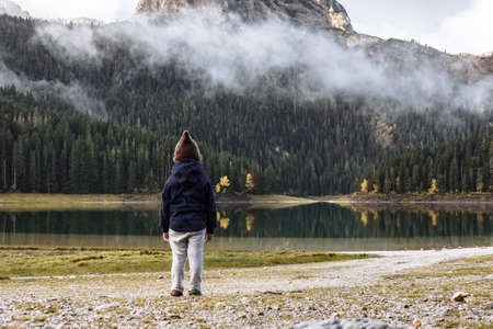 Boy in a funny hat looking at Black Lake, Durmitor National Park, Zabljak, Montenegro