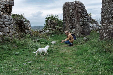 Man traveler with hat and backpack enjoying the natural surroundingsの写真素材