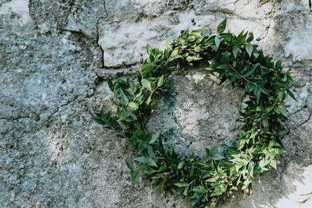 Christmas wreath with fir cones on concrete background. の写真素材