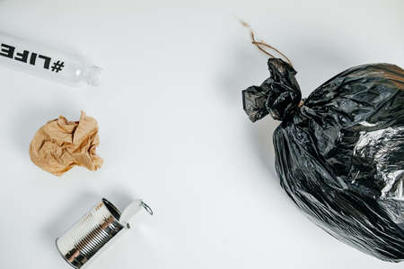 Separate waste with Plastic Bottle Tin Bank and Paper On White  Background, Top Viewの写真素材