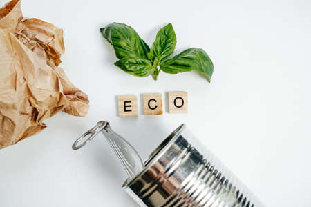Aluminum tin and green leaf on the White Background. Eco Concept, Top Viewの写真素材