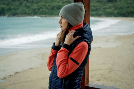 Portrait of Young woman wearing a sports vest is standing by the sea