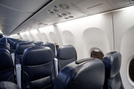 Empty passenger airplane seats in the cabin of planeの写真素材