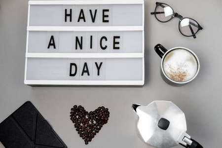 Cappuccino, coffee pot and and mood board in the grey background. Top viewの写真素材