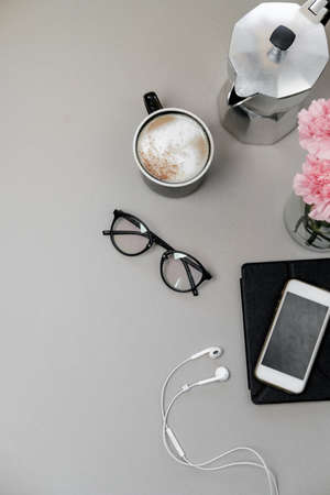 Grey wood office desk table and equipment for working, phone and coffee. Top view, Flat lay
の写真素材