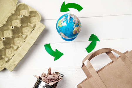 Separate garbage collection: paper bag, egg packing and aluminum can. Eco concept. Flat layの写真素材
