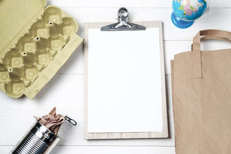 Separate garbage collection: paper bag, egg packing and aluminum can. Eco concept. Flat layの写真素材