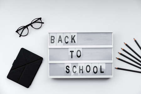 Back to School blocks with school supplies on white desk. Top view, flat lay
の写真素材