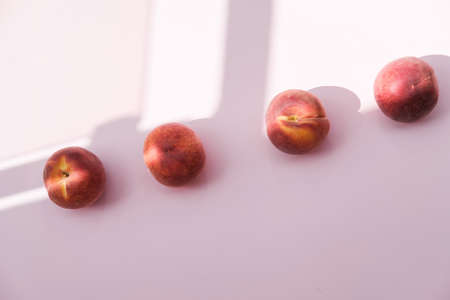 Ripe Organic Peach on pink background. Flat lay, top viewの写真素材