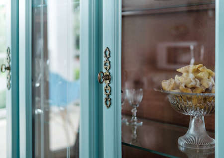 Eastern Sweets in a vase in a blue sideboardの写真素材