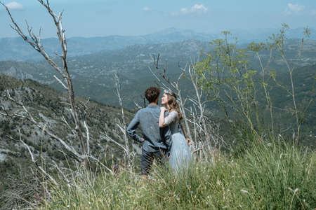Stylish Romantic  couple against the background of the mountains.の写真素材
