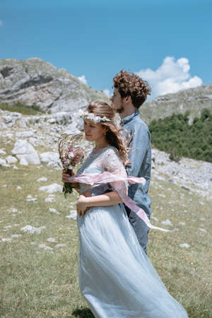 Stylish Romantic  couple against the background of the mountains.の写真素材