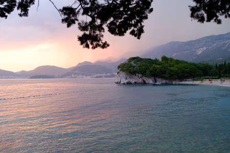 Beautiful sunset at the sea with a view of the mountains. Montenegro, the Adriatic Sea, the Balkans.の写真素材
