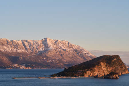 View of Budva, the old town in Montenegro at sunset and snow-capped mountainsの写真素材