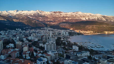 View of Budva, the old town in Montenegro at sunset and snow-capped mountainsの写真素材