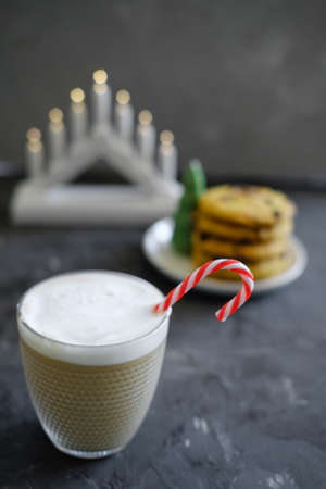 Christmas cookies with chocolate and cocoa on the background of candles.の写真素材