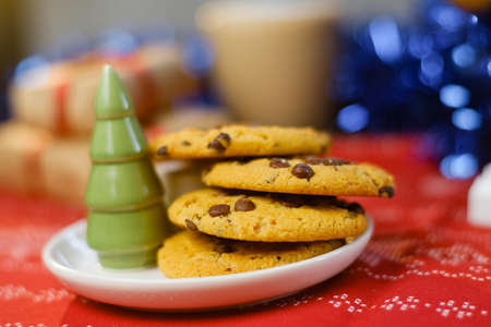 Christmas cookies with chocolate and cocoa on the background of candles.の写真素材