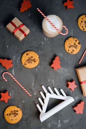 Flat lay composition with Christmas cookies, decor  and cocoa on the black tableの写真素材
