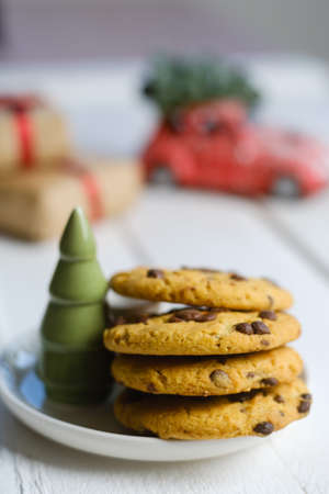 Christmas cookies with chocolate and cocoa on the background of candles.の写真素材