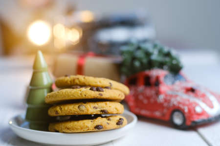Christmas cookies with chocolate and cocoa on the background of candles.の写真素材