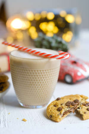 Christmas cookies with chocolate and cocoa on the background of candles.の写真素材