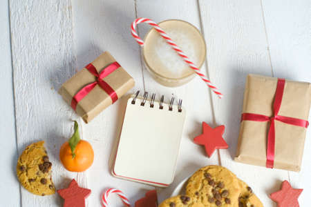 Flat lay composition with Christmas cookies, decor  and cocoa on the white tableの写真素材