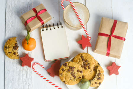 Flat lay composition with Christmas cookies, decor  and cocoa on the white tableの写真素材