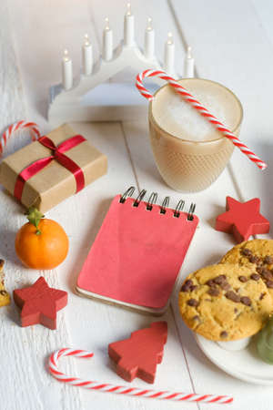 Christmas cookies with chocolate and cocoa on the background of candles.の写真素材
