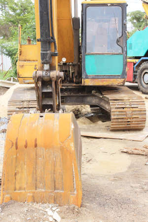 shiny and modern yellow excavator machines 