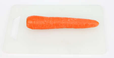 Carrot on cutting boardの写真素材
