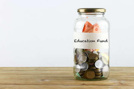 Glass container as piggy bank on white backgroundの写真素材